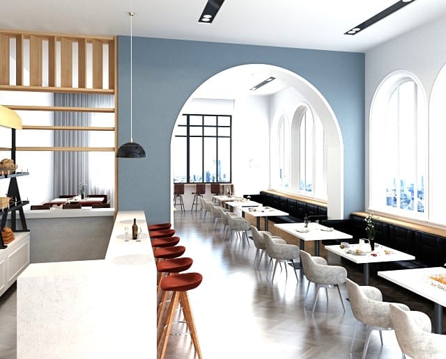 おしゃれな店内。キッチンカウンターと机やいすが並んでいる